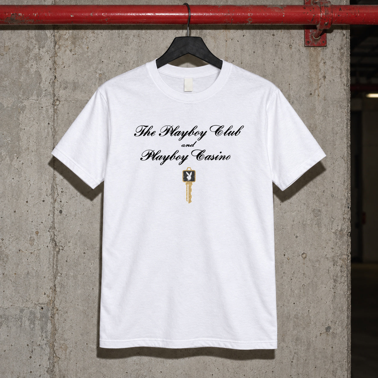 The playboy club white tshirt — white tee, front print, garage setting